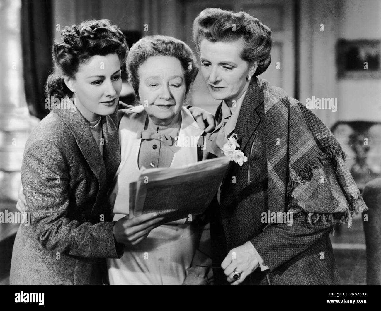 Irene Dunne, Dame May Whitty & Gladys Cooper Film: The White Cliffs Of Dover (1944) Characters: Susan Dunn,Nanny & Lady Jean Ashwood  Director: Clarence Brown 11 May 1944   **WARNING** This Photograph is for editorial use only and is the copyright of MGM and/or the Photographer assigned by the Film or Production Company and can only be reproduced by publications in conjunction with the promotion of the above Film. A Mandatory Credit To MGM is required. The Photographer should also be credited when known. No commercial use can be granted without written authority from the Film Company. Stock Photo