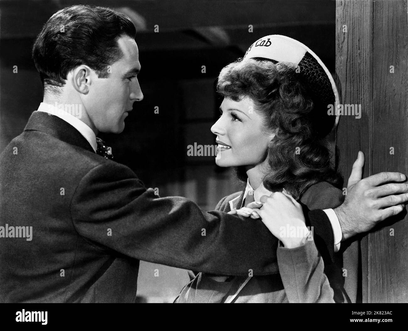 Gene Kelly & Rita Hayworth Film: Cover Girl (USA 1944) Characters: Danny McGuire & Rusty Parker nicknamed 'Chicken' / Maribelle Hicks (flashback sequence)  Director: Charles Vidor 20 March 1944   **WARNING** This Photograph is for editorial use only and is the copyright of COLUMBIA PICTURES and/or the Photographer assigned by the Film or Production Company and can only be reproduced by publications in conjunction with the promotion of the above Film. A Mandatory Credit To COLUMBIA PICTURES is required. The Photographer should also be credited when known. No commercial use can be granted withou Stock Photo