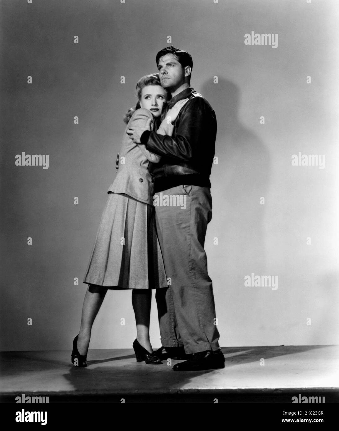 Priscilla Lane & Robert Cummings  Film Saboteur (1944) Characters: Patricia 'Pat' Martin & Barry Kane  Director: Alfred Hitchcock 22 April 1942   **WARNING** This Photograph is for editorial use only and is the copyright of UNIVERSAL and/or the Photographer assigned by the  Film or Production Company and can only be reproduced by publications in conjunction with the promotion of the above  Film. A Mandatory Credit To UNIVERSAL is required. The Photographer should also be credited when known. No commercial use can be granted without written authority from the  Film Company. Stock Photo