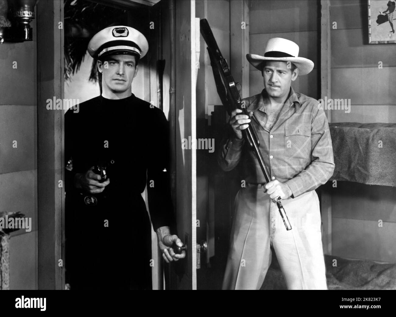 Kane Richmond & Roy Barcroft Film: Haunted Harbor (USA 1944) Characters: Jim Marsden & Carter, alias Kane  Director: Spencer G Bennet, W Grissell 26 August 1944   **WARNING** This Photograph is for editorial use only and is the copyright of REPUBLIC PICTURES and/or the Photographer assigned by the Film or Production Company and can only be reproduced by publications in conjunction with the promotion of the above Film. A Mandatory Credit To REPUBLIC PICTURES is required. The Photographer should also be credited when known. No commercial use can be granted without written authority from the Film Stock Photo