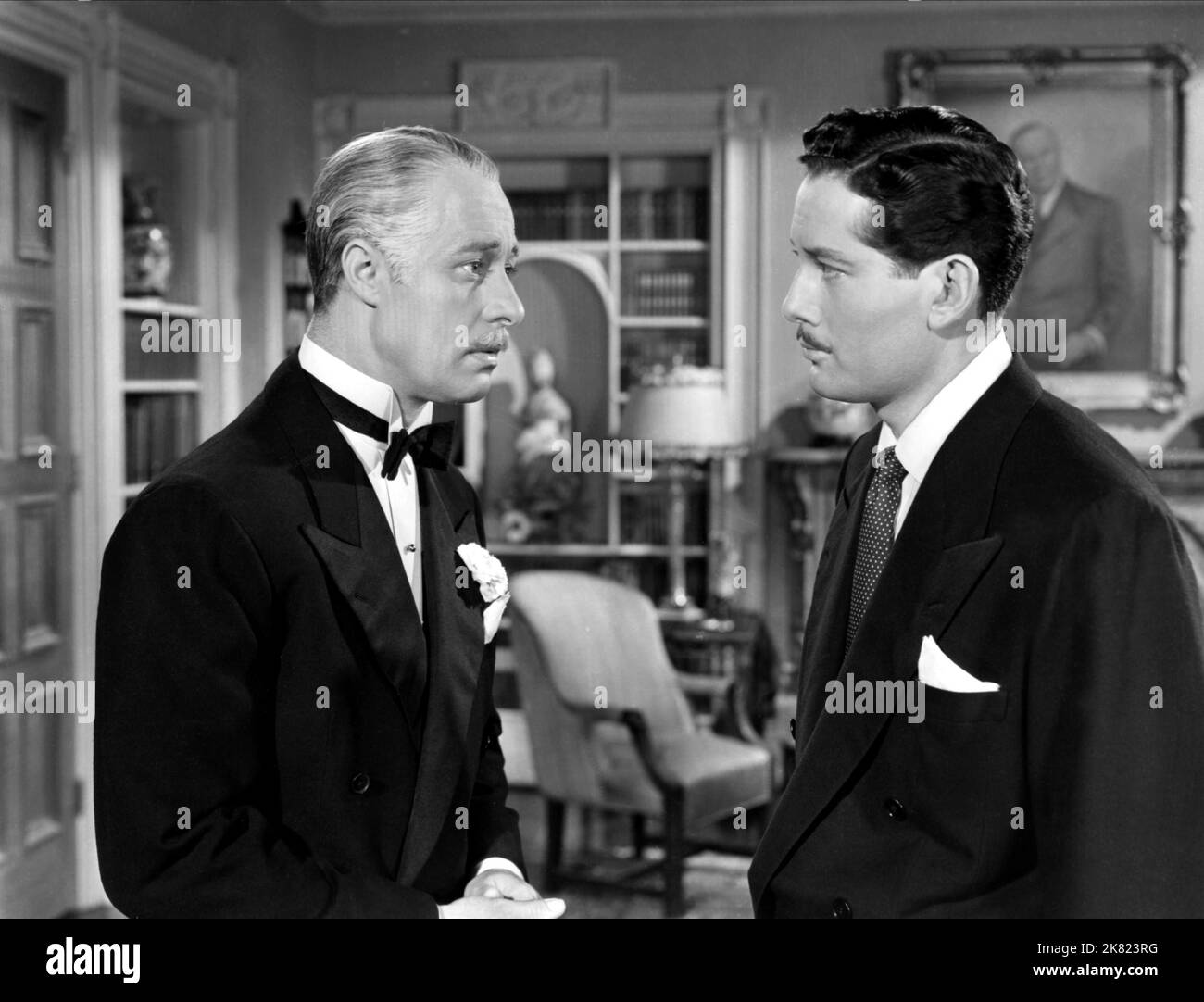 Tod Andrews & Don Ameche Film: Heaven Can Wait (1943) Characters: Jack Van Cleve (as Michael Ames) & Henry Van Cleve  Director: Ernst Lubitsch 11 August 1943   **WARNING** This Photograph is for editorial use only and is the copyright of 20 CENTURY FOX and/or the Photographer assigned by the Film or Production Company and can only be reproduced by publications in conjunction with the promotion of the above Film. A Mandatory Credit To 20 CENTURY FOX is required. The Photographer should also be credited when known. No commercial use can be granted without written authority from the Film Company. Stock Photo