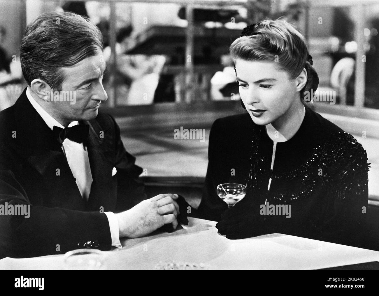 Claude Rains & Ingrid Bergman Film: Notorious (USA 1964) Characters: Alexander Sebastian, Alicia Huberman  Director: Alfred Hitchcock 15 August 1946   **WARNING** This Photograph is for editorial use only and is the copyright of RKO and/or the Photographer assigned by the Film or Production Company and can only be reproduced by publications in conjunction with the promotion of the above Film. A Mandatory Credit To RKO is required. The Photographer should also be credited when known. No commercial use can be granted without written authority from the Film Company. Stock Photo