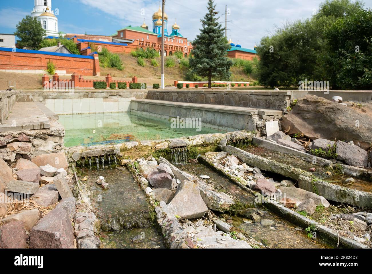 Open pool with spring water at the walls of the Zadonsky Nativity of ...