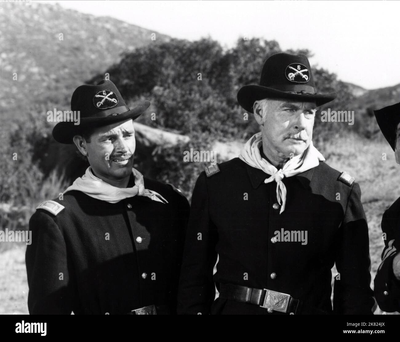Tom Neal & Fuzzy Knight Film: Apache Chief (USA 1949) Characters: Lieutenant Brown, Sergeant Nevada  Director: Frank Mcdonald 04 November 1949   **WARNING** This Photograph is for editorial use only and is the copyright of LIPPERT PICTURES and/or the Photographer assigned by the Film or Production Company and can only be reproduced by publications in conjunction with the promotion of the above Film. A Mandatory Credit To LIPPERT PICTURES is required. The Photographer should also be credited when known. No commercial use can be granted without written authority from the Film Company. Stock Photo