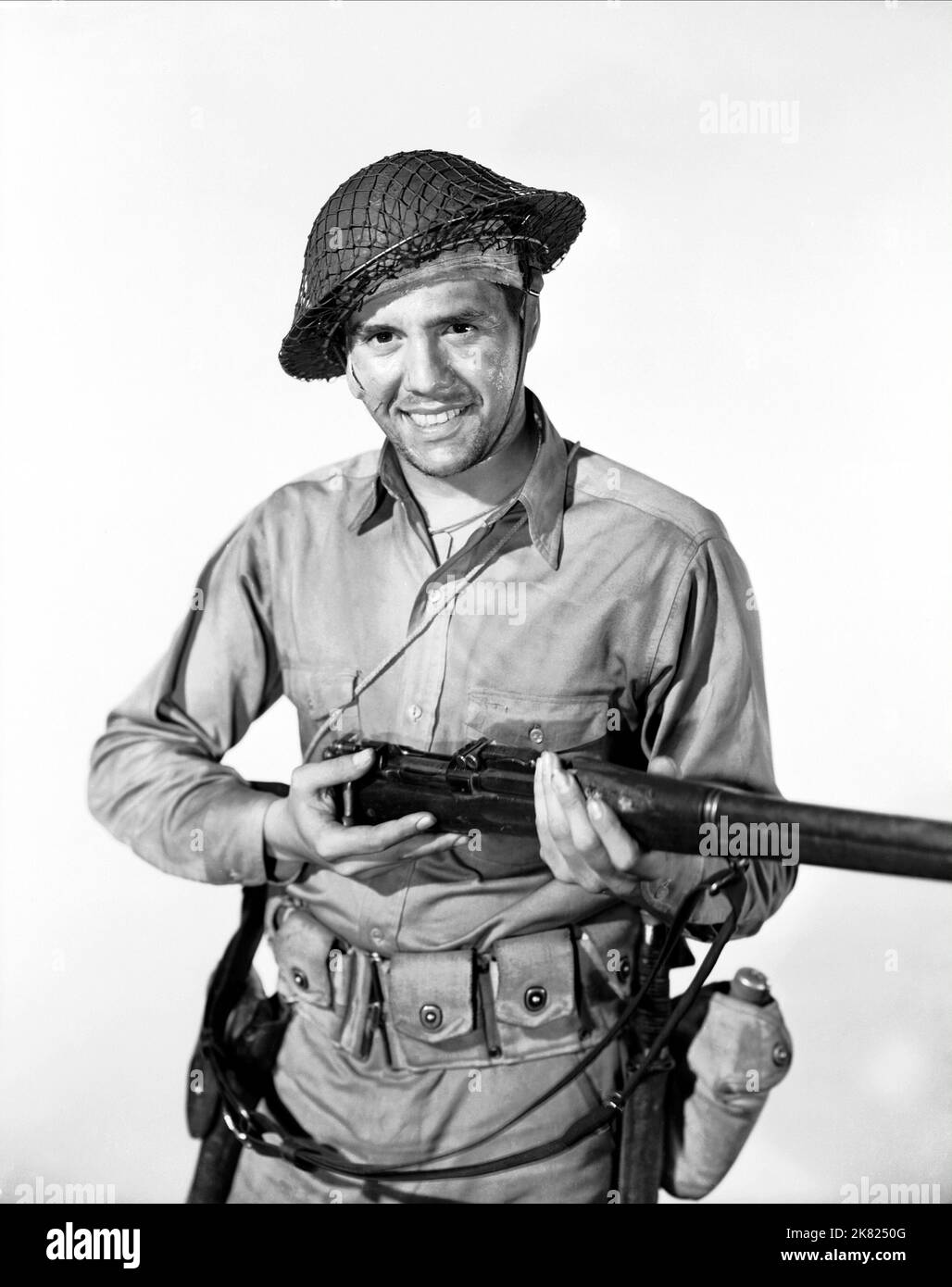 Desi Arnaz Film: Bataan (USA 1943) Characters: Felix Ramirez  Director: Tay Garnett 03 June 1943   **WARNING** This Photograph is for editorial use only and is the copyright of MGM and/or the Photographer assigned by the Film or Production Company and can only be reproduced by publications in conjunction with the promotion of the above Film. A Mandatory Credit To MGM is required. The Photographer should also be credited when known. No commercial use can be granted without written authority from the Film Company. Stock Photo