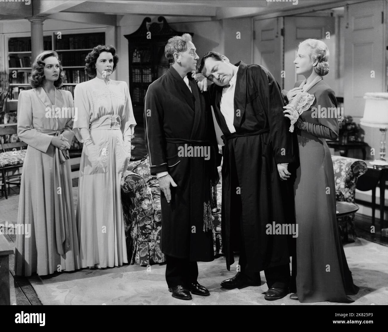 Rosemary Decamp, Ann Harding, Edward Arnold & Donna Reed Film: Eyes In The Night (1942) Characters: Vera Hoffman, Lawry's maid (as Rosemary de Camp), Norma Lawry, Duncan 'Mac' Maclain, Barbara Lawry  Director: Fred Zinnemann 16 October 1942   **WARNING** This Photograph is for editorial use only and is the copyright of MGM and/or the Photographer assigned by the Film or Production Company and can only be reproduced by publications in conjunction with the promotion of the above Film. A Mandatory Credit To MGM is required. The Photographer should also be credited when known. No commercial use ca Stock Photo