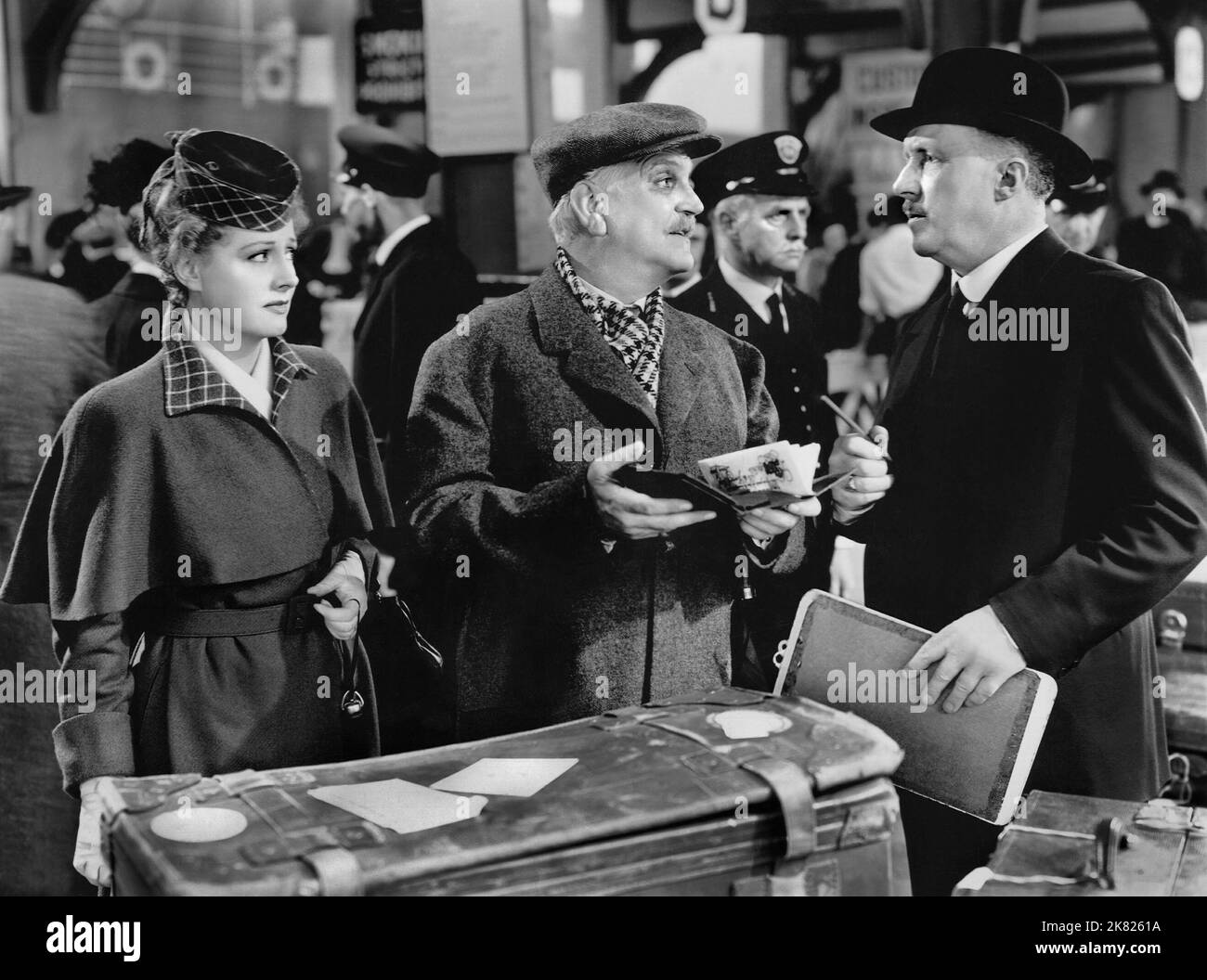 Irene Dunne, Frank Morgan & Matthew Boulton Film: The White Cliffs Of Dover (1948) Characters: Susan Dunn,Hiram Porter Dunn & Immigration Officer (uncredited)  Director: Clarence Brown 11 May 1944   **WARNING** This Photograph is for editorial use only and is the copyright of MGM and/or the Photographer assigned by the Film or Production Company and can only be reproduced by publications in conjunction with the promotion of the above Film. A Mandatory Credit To MGM is required. The Photographer should also be credited when known. No commercial use can be granted without written authority from Stock Photo