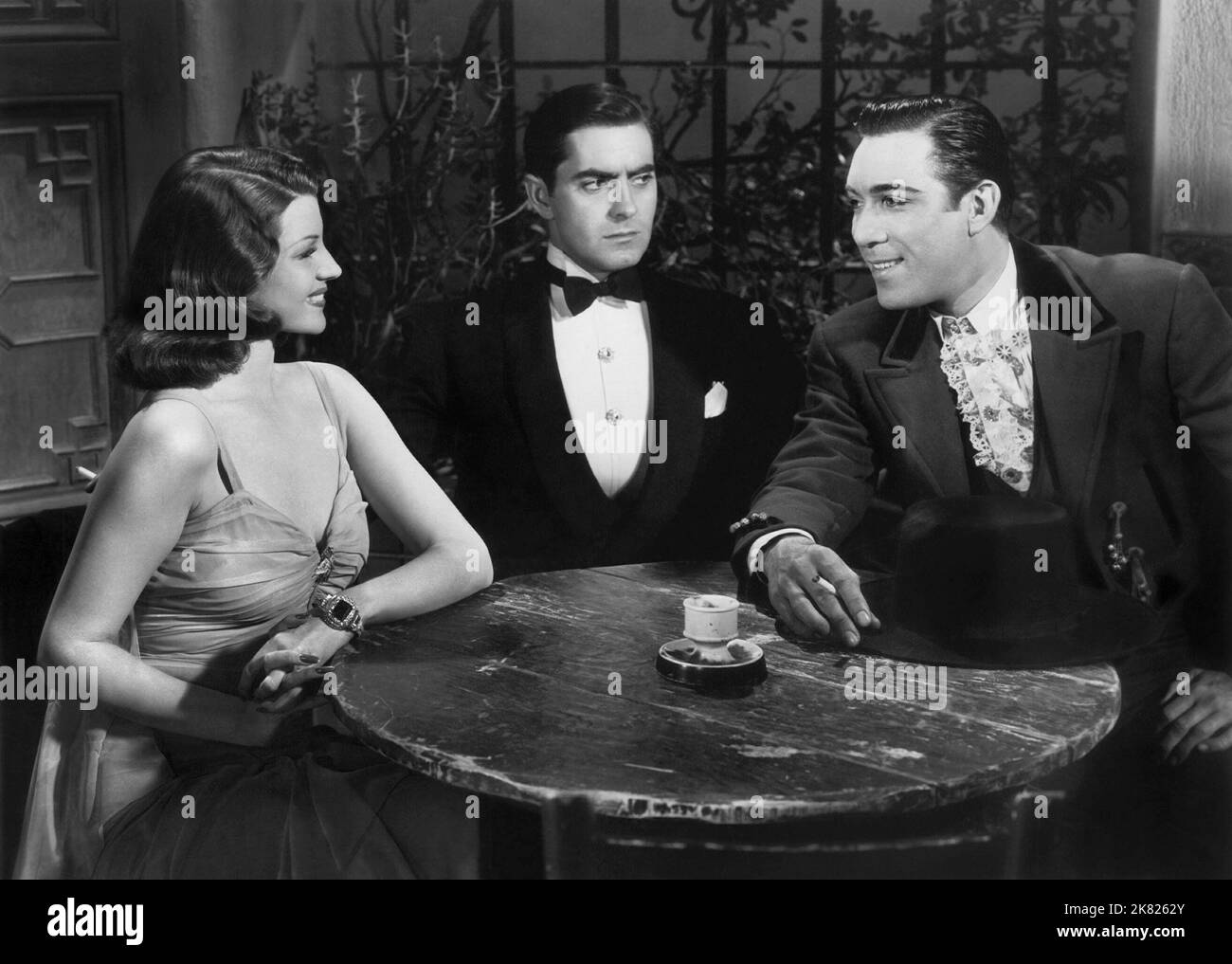 Rita Hayworth, Tyrone Power & Anthony Quinn Film: Blood And Sand (1941) Characters: Dona Sol des Muire,Juan Gallardo & Manola de Palma  Director: Rouben Mamoulian 22 May 1941   **WARNING** This Photograph is for editorial use only and is the copyright of 20 CENTURY FOX and/or the Photographer assigned by the Film or Production Company and can only be reproduced by publications in conjunction with the promotion of the above Film. A Mandatory Credit To 20 CENTURY FOX is required. The Photographer should also be credited when known. No commercial use can be granted without written authority from Stock Photo