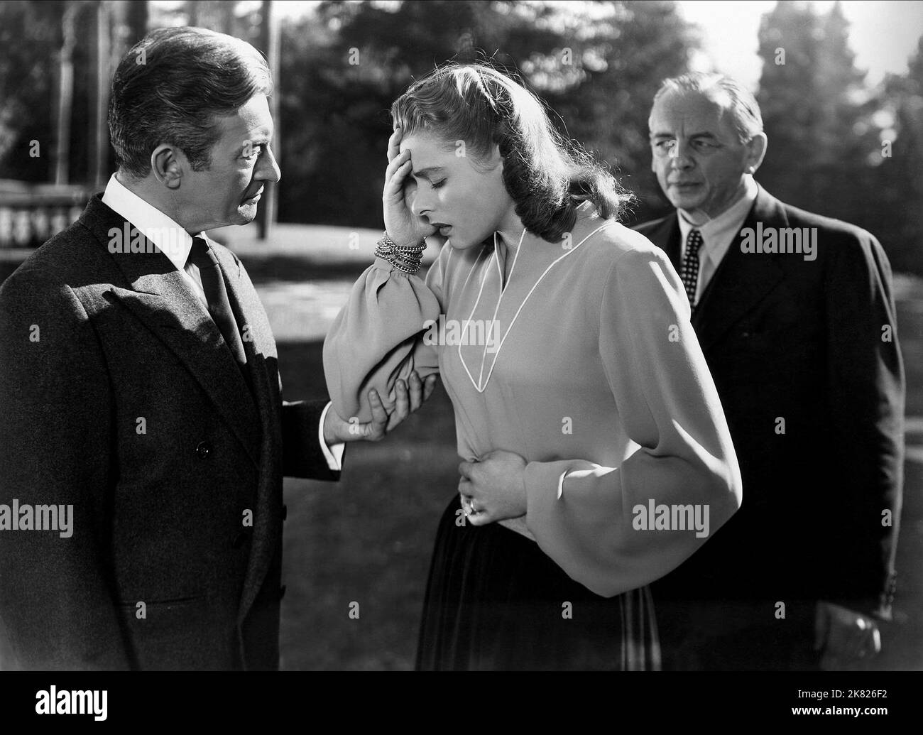 Claude Rains & Ingrid Bergman Film: Notorious (USA 1964) Characters: Alexander Sebastian & Alicia Huberman  Director: Alfred Hitchcock 15 August 1946   **WARNING** This Photograph is for editorial use only and is the copyright of RKO and/or the Photographer assigned by the Film or Production Company and can only be reproduced by publications in conjunction with the promotion of the above Film. A Mandatory Credit To RKO is required. The Photographer should also be credited when known. No commercial use can be granted without written authority from the Film Company. Stock Photo