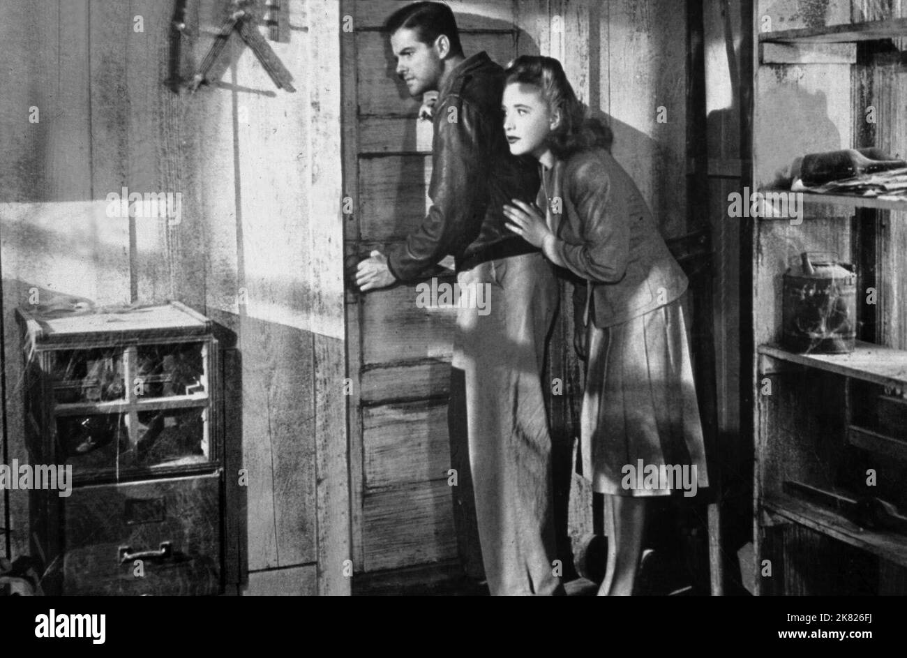 Robert Cummings & Priscilla Lane  Film Saboteur (1941) Characters: Barry Kane & Patricia 'Pat' Martin  Director: Alfred Hitchcock 22 April 1942   **WARNING** This Photograph is for editorial use only and is the copyright of UNIVERSAL and/or the Photographer assigned by the  Film or Production Company and can only be reproduced by publications in conjunction with the promotion of the above  Film. A Mandatory Credit To UNIVERSAL is required. The Photographer should also be credited when known. No commercial use can be granted without written authority from the  Film Company. Stock Photo