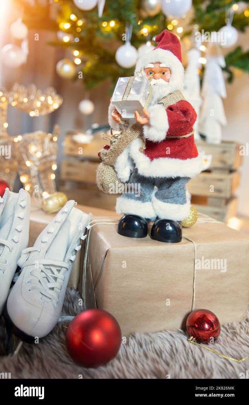 Santa claus figurine at christmas tree Stock Photo