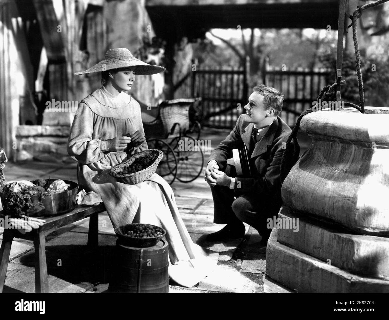Greer Garson & Van Johnson  Film Madame Curie (1944) Characters: Marie Curie & Reporter  Director: Mervyn Leroy 15 December 1943   **WARNING** This Photograph is for editorial use only and is the copyright of MGM and/or the Photographer assigned by the  Film or Production Company and can only be reproduced by publications in conjunction with the promotion of the above  Film. A Mandatory Credit To MGM is required. The Photographer should also be credited when known. No commercial use can be granted without written authority from the  Film Company. Stock Photo