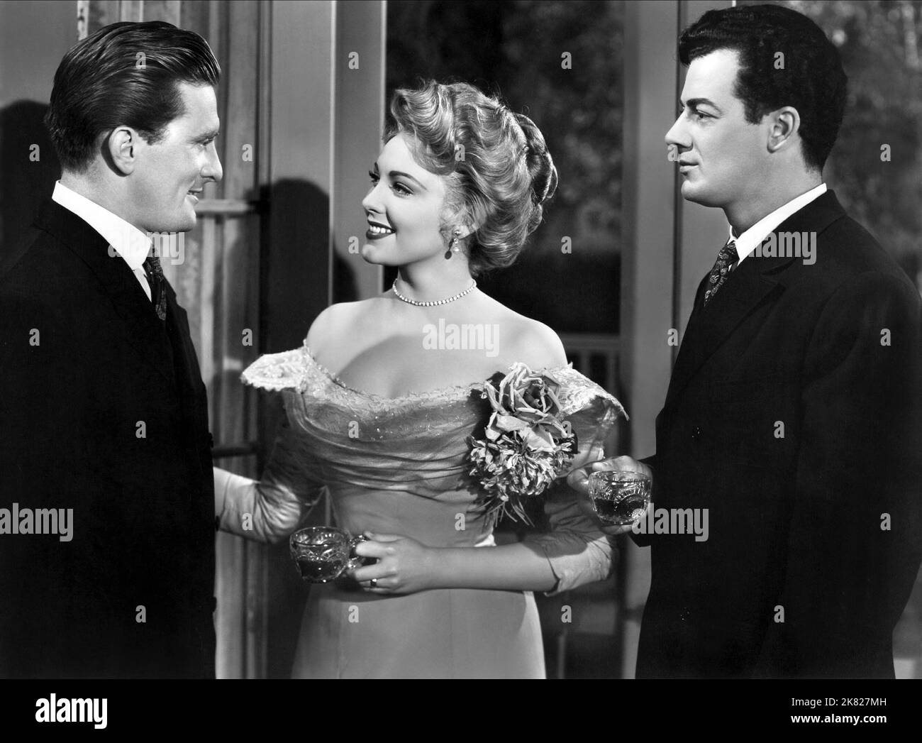 Kirk Douglas, Linda Darnell & Cornel Wilde Film: The Walls Of Jericho (USA 1948) Characters: Tucker Wedge, Algeria Wedge, Dave Connors  Director: John M. Stahl 04 August 1948   **WARNING** This Photograph is for editorial use only and is the copyright of 20TH CENTURY FOX and/or the Photographer assigned by the Film or Production Company and can only be reproduced by publications in conjunction with the promotion of the above Film. A Mandatory Credit To 20TH CENTURY FOX is required. The Photographer should also be credited when known. No commercial use can be granted without written authority f Stock Photo