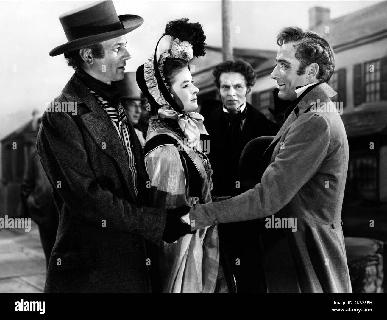 Joseph Cotten, Ingrid Bergman & Michael Wilding Film: Under Capricorn (1949) Characters: Sam Flusky, Lady Henrietta Flusky, Hon. Charles Adare  Director: Alfred Hitchcock 08 September 1949   **WARNING** This Photograph is for editorial use only and is the copyright of WARNER BROS and/or the Photographer assigned by the Film or Production Company and can only be reproduced by publications in conjunction with the promotion of the above Film. A Mandatory Credit To WARNER BROS is required. The Photographer should also be credited when known. No commercial use can be granted without written authori Stock Photo