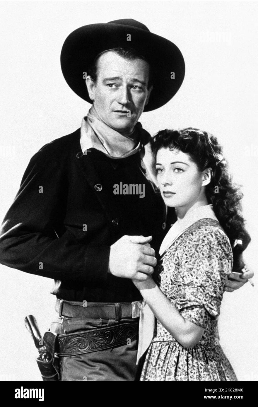 John Wayne & Gail Russell Film: Angel And The Badman; The Angel And The Outlaw (1948) Characters: Quirt Evans, Penelope Worth  Director: James Edward Grant 15 February 1947   **WARNING** This Photograph is for editorial use only and is the copyright of REPUBLIC and/or the Photographer assigned by the Film or Production Company and can only be reproduced by publications in conjunction with the promotion of the above Film. A Mandatory Credit To REPUBLIC is required. The Photographer should also be credited when known. No commercial use can be granted without written authority from the Film Compa Stock Photo