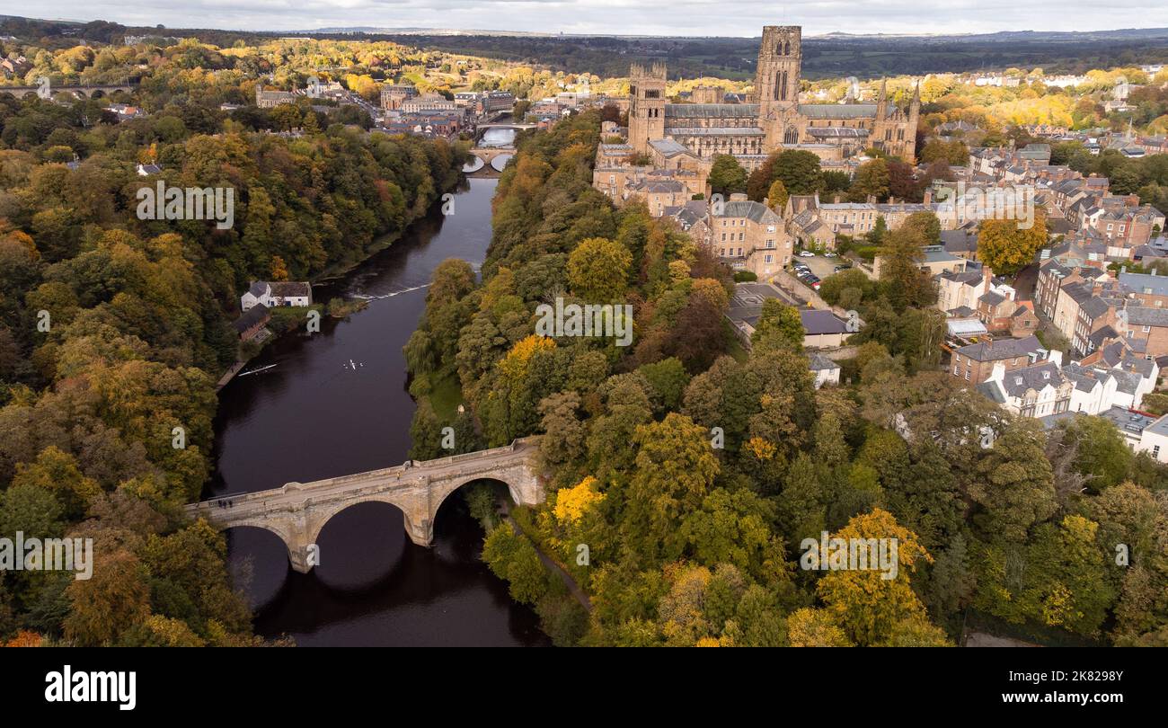 Durham, England, UK - Tuesday 18th October. An Aerial view of Durham City Durham Cathedral is seen from the air surrounded by autumnal-colored trees. Stock Photo