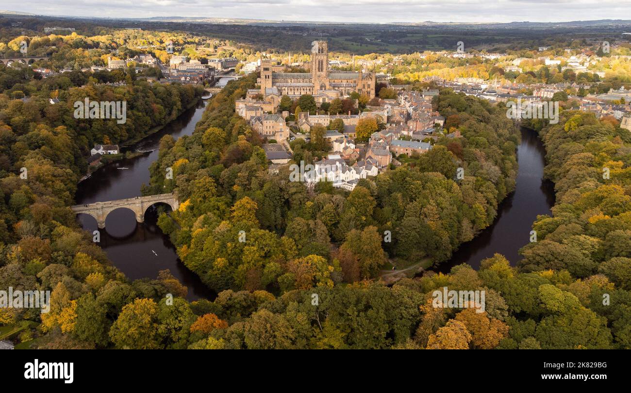 Durham, England, UK - Tuesday 18th October. An Aerial view of Durham City Durham Cathedral is seen from the air surrounded by autumnal-colored trees. Stock Photo