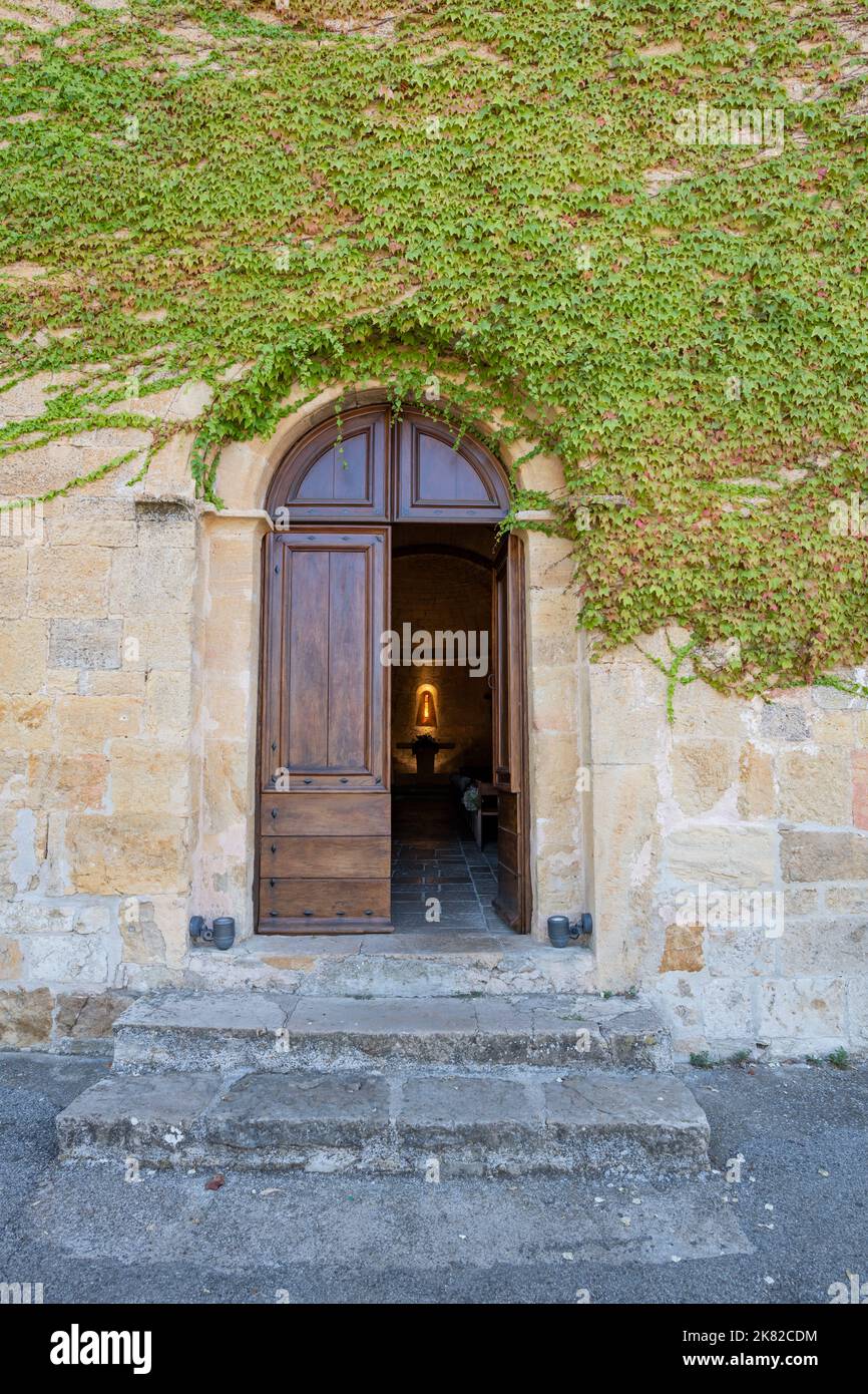 Entrance and door of Saint Denis Church at Tourtour, South of France Stock Photo