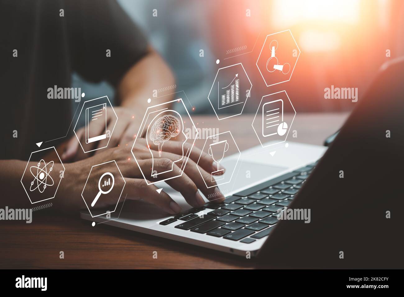 Businessman using laptop computer icon virtual screen education online and e learning on desk. Stock Photo