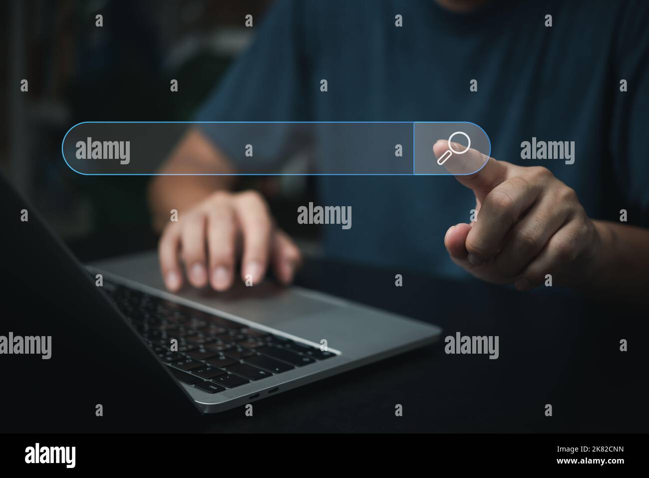 man hand searching browsing for information internet data Technology on computer keyboard notebook.SEO Search Engine Optimization. Stock Photo