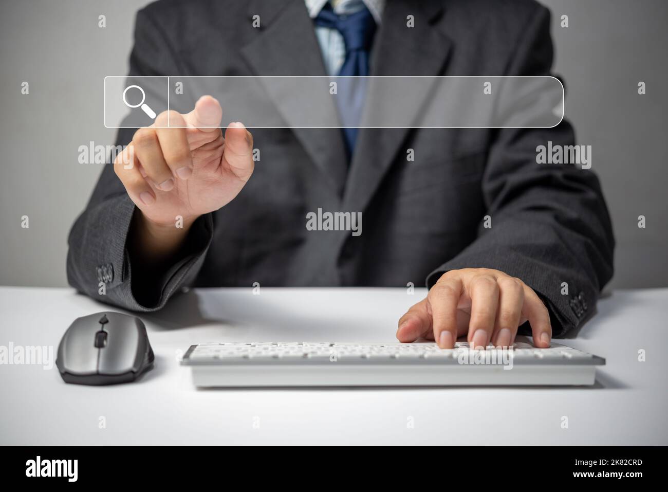 man hand searching browsing for information internet data Technology on computer keyboard notebook.SEO Search Engine Optimization. Stock Photo