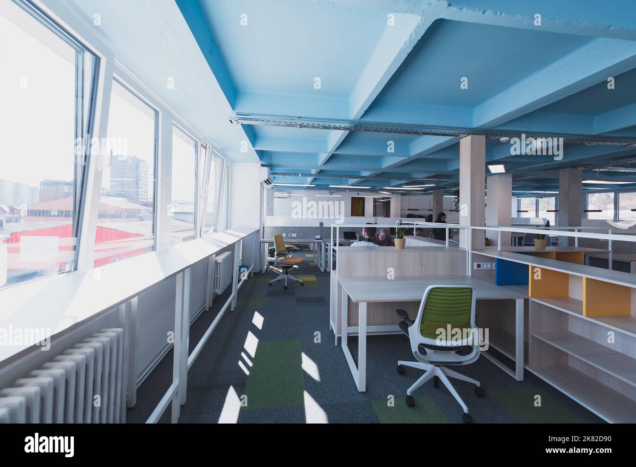 Interior of cozy light boardroom with table, modern stylish chairs and