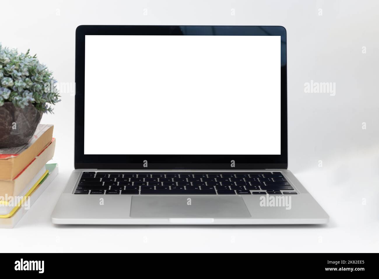 Mockup computer laptop display blank screen on desk in office. Stock Photo