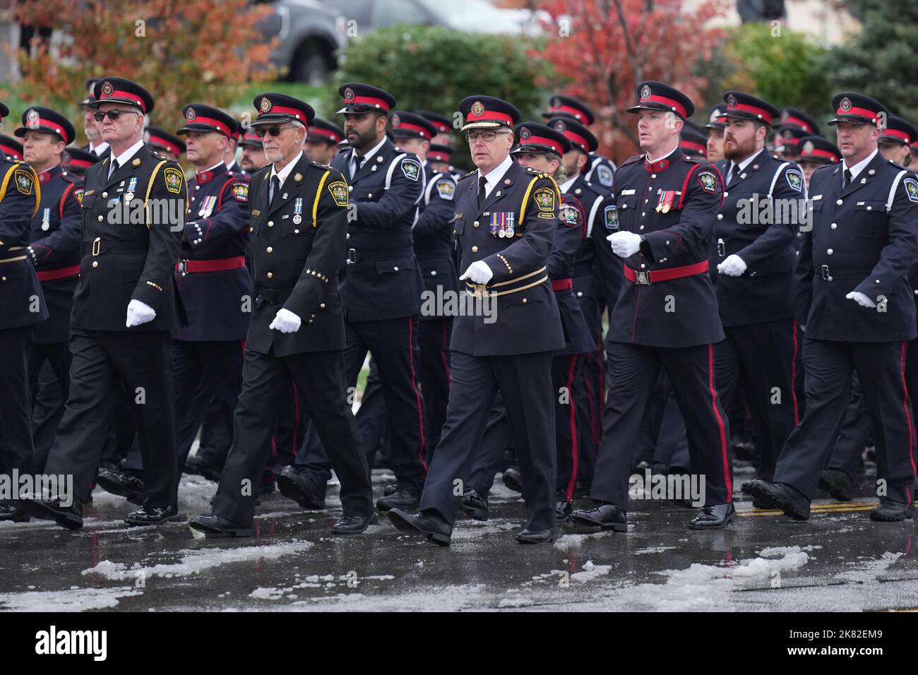 Police officers from different jurisdictions march in a procession