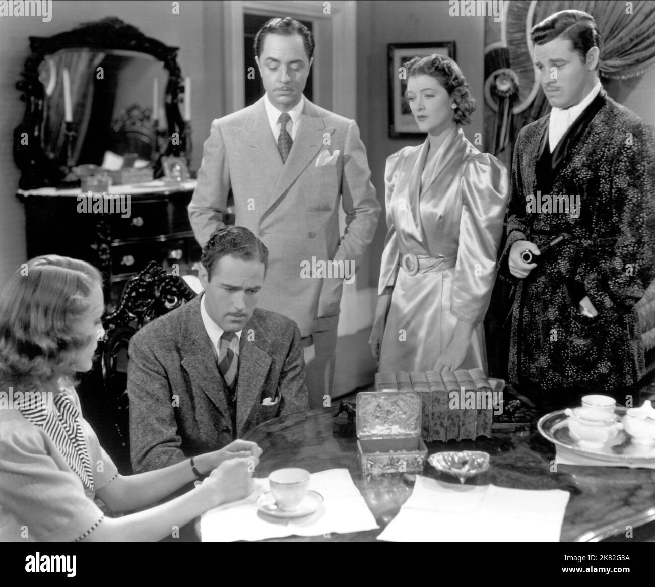 Virginia Grey, Patric Knowles, William Powell, Myrna Loy & Tom Neal Film: Another Thin Man (USA 1939) Characters: Lois MacFay / Linda Mills, Dudley Horn, Lois' Fiance, Nick Charles, Nora Charles, Freddie Coleman, MacFay's Secretary  Director: W.S. Van Dyke 17 November 1939   **WARNING** This Photograph is for editorial use only and is the copyright of MGM and/or the Photographer assigned by the Film or Production Company and can only be reproduced by publications in conjunction with the promotion of the above Film. A Mandatory Credit To MGM is required. The Photographer should also be credited Stock Photo