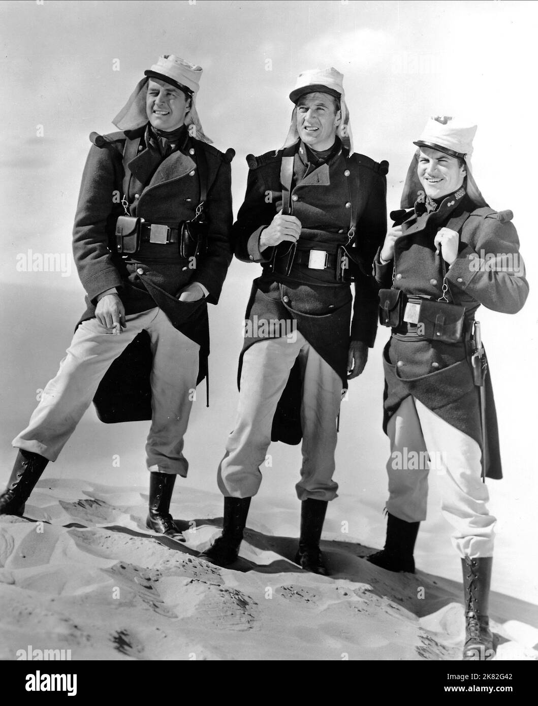 Gary Cooper, Ray Milland & Robert Preston Film: Beau Geste (USA 1939) Characters: Michael 'Beau' Geste, John Geste, Digby Geste  Director: William A. Wellman 24 July 1939   **WARNING** This Photograph is for editorial use only and is the copyright of PARAMOUNT and/or the Photographer assigned by the Film or Production Company and can only be reproduced by publications in conjunction with the promotion of the above Film. A Mandatory Credit To PARAMOUNT is required. The Photographer should also be credited when known. No commercial use can be granted without written authority from the Film Compa Stock Photo