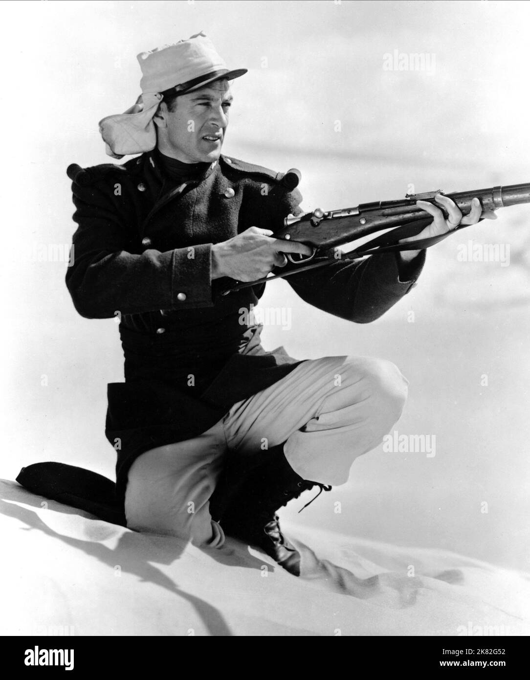 Gary Cooper Film: Beau Geste (USA 1939) Characters: Michael 'Beau' Geste  Director: William A. Wellman 24 July 1939   **WARNING** This Photograph is for editorial use only and is the copyright of PARAMOUNT and/or the Photographer assigned by the Film or Production Company and can only be reproduced by publications in conjunction with the promotion of the above Film. A Mandatory Credit To PARAMOUNT is required. The Photographer should also be credited when known. No commercial use can be granted without written authority from the Film Company. Stock Photo