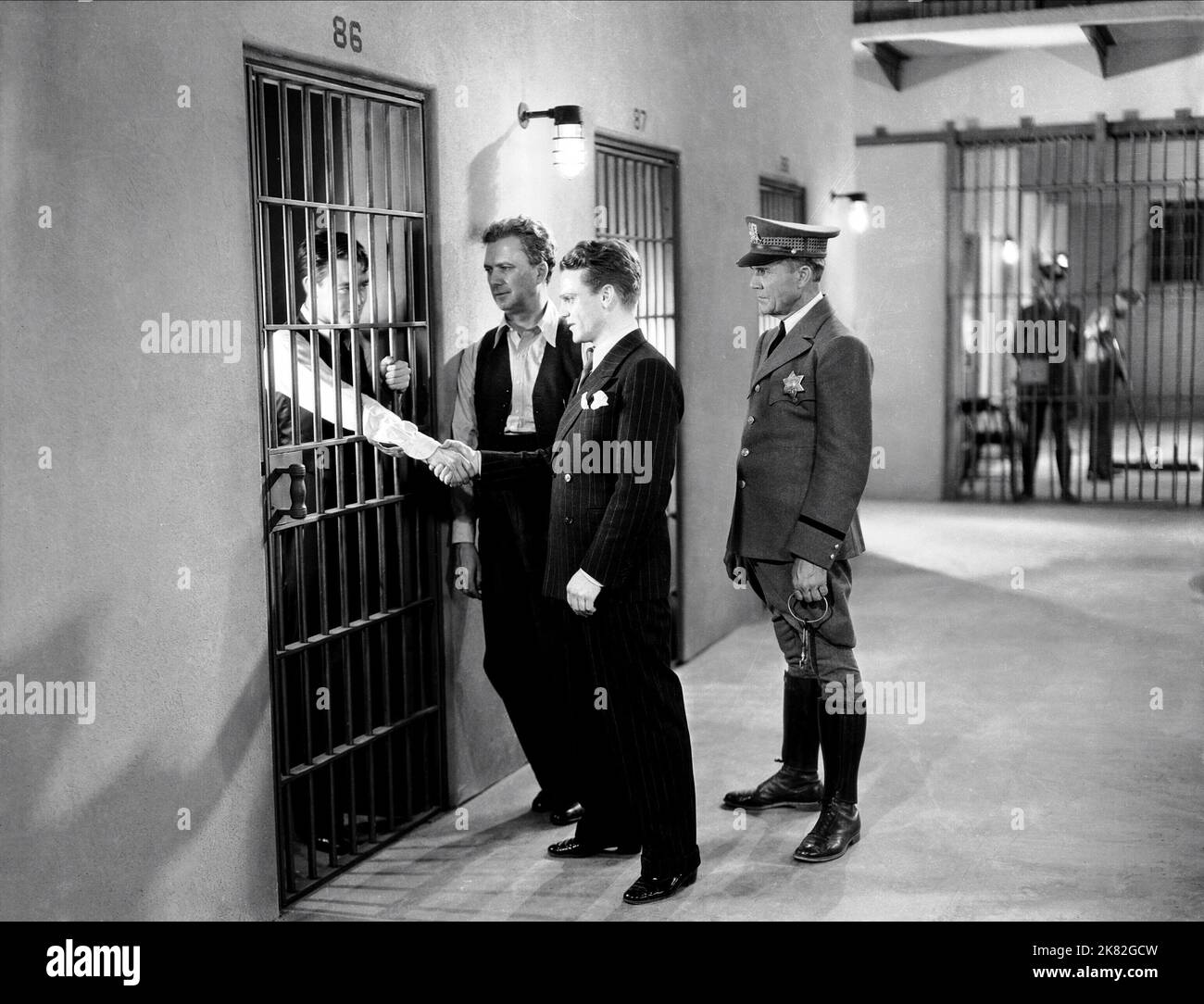 Lew Ayers, Robert Elliott & James Cagney Film: The Doorway To Hell (USA 1930) Characters: Louie, O'Grady, Mileaway  Director: Archie Mayo 18 October 1930   **WARNING** This Photograph is for editorial use only and is the copyright of WARNER BROS. and/or the Photographer assigned by the Film or Production Company and can only be reproduced by publications in conjunction with the promotion of the above Film. A Mandatory Credit To WARNER BROS. is required. The Photographer should also be credited when known. No commercial use can be granted without written authority from the Film Company. Stock Photo