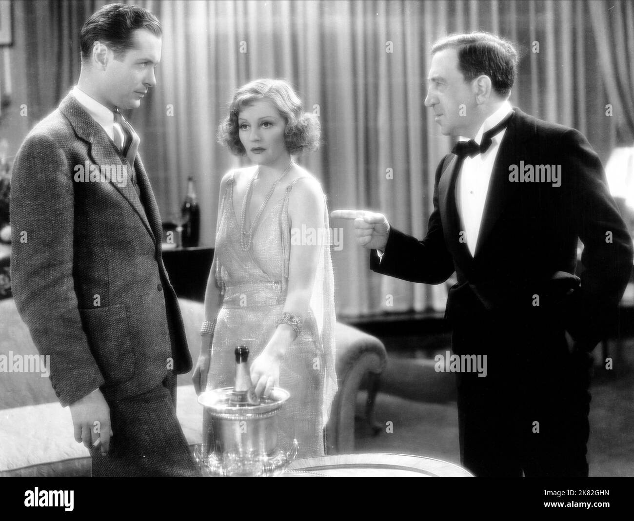 Robert Montgomery, Tallulah Bankhead & Hugh Herbert Film: Faithless (1933) Characters: William 'Bill' Wade, Carol Morgan, Mr. Peter M. Blainey  Director: Harry Beaumont 01 May 1932   **WARNING** This Photograph is for editorial use only and is the copyright of MGM and/or the Photographer assigned by the Film or Production Company and can only be reproduced by publications in conjunction with the promotion of the above Film. A Mandatory Credit To MGM is required. The Photographer should also be credited when known. No commercial use can be granted without written authority from the Film Company Stock Photo