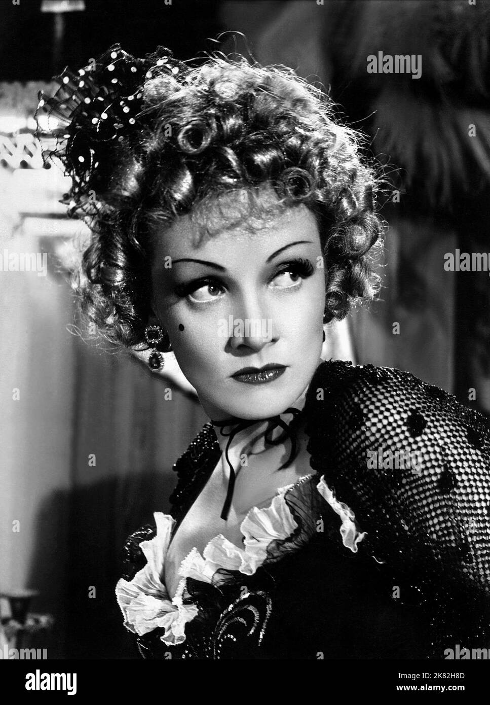 Marlene Dietrich Film: Destry Rides Again (USA 1939) Characters: Frenchy  Director: George Marshall 30 November 1939   **WARNING** This Photograph is for editorial use only and is the copyright of UNIVERSAL and/or the Photographer assigned by the Film or Production Company and can only be reproduced by publications in conjunction with the promotion of the above Film. A Mandatory Credit To UNIVERSAL is required. The Photographer should also be credited when known. No commercial use can be granted without written authority from the Film Company. Stock Photo