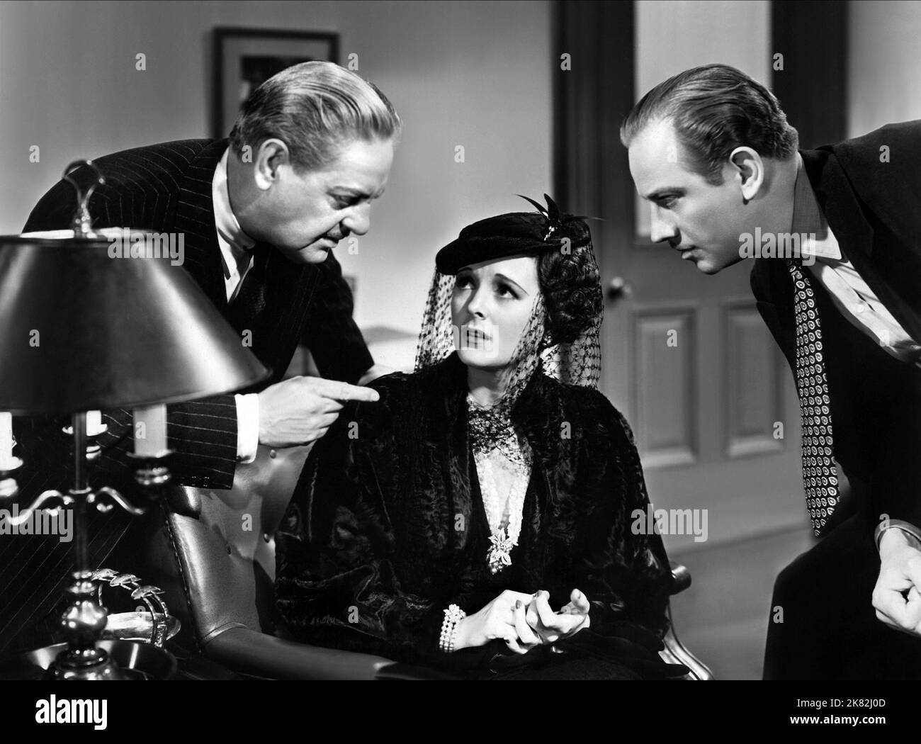 Thurston Hall, Mary Astor & Melvyn Douglas Film: There'S Always A Woman (1936) Characters: District Attorney, Lola Fraser, William Reardon  Director: Alexander Hall 20 April 1938   **WARNING** This Photograph is for editorial use only and is the copyright of COLUMBIA PICTURES and/or the Photographer assigned by the Film or Production Company and can only be reproduced by publications in conjunction with the promotion of the above Film. A Mandatory Credit To COLUMBIA PICTURES is required. The Photographer should also be credited when known. No commercial use can be granted without written autho Stock Photo