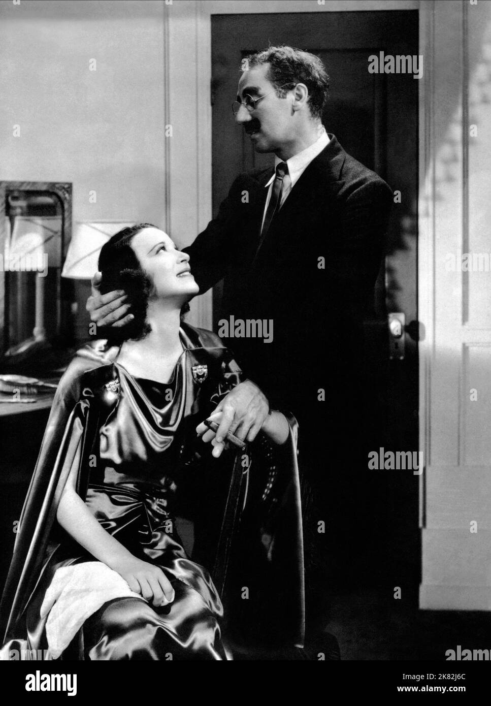 Kitty Carlisle & Groucho Marx Film: A Day At The Races (1937) Characters: Dr. Hugo Z. Hackenbush  Director: Sam Wood 11 June 1937   **WARNING** This Photograph is for editorial use only and is the copyright of MGM and/or the Photographer assigned by the Film or Production Company and can only be reproduced by publications in conjunction with the promotion of the above Film. A Mandatory Credit To MGM is required. The Photographer should also be credited when known. No commercial use can be granted without written authority from the Film Company. Stock Photo