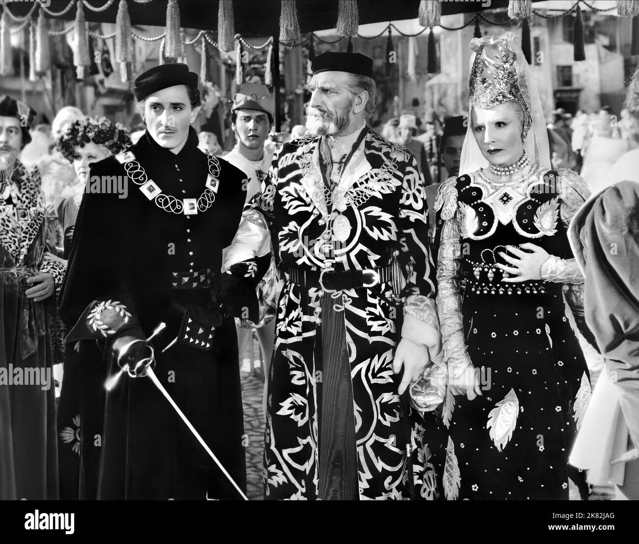 Basil Rathbone, C. Aubrey Smith & Violet Kemble Cooper Film: Romeo And Juliet (1921) Characters: Tybalt - Nephew to Lady Capulet, Lord Capulet, Lady Capulet - Wife to Capulet  Director: George Cukor 01 May 1936   **WARNING** This Photograph is for editorial use only and is the copyright of MGM and/or the Photographer assigned by the Film or Production Company and can only be reproduced by publications in conjunction with the promotion of the above Film. A Mandatory Credit To MGM is required. The Photographer should also be credited when known. No commercial use can be granted without written a Stock Photo