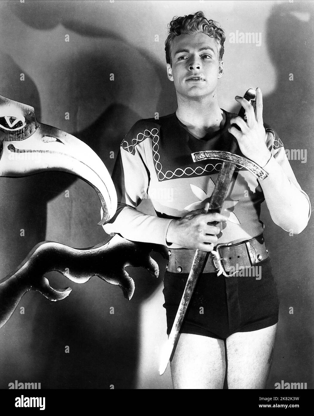 Buster Crabbe Film: Flash Gordon (USA 1936) Characters: Flash Gordon  Director: Frederick Stephani 06 April 1936   **WARNING** This Photograph is for editorial use only and is the copyright of UNIVERSAL PICTURES and/or the Photographer assigned by the Film or Production Company and can only be reproduced by publications in conjunction with the promotion of the above Film. A Mandatory Credit To UNIVERSAL PICTURES is required. The Photographer should also be credited when known. No commercial use can be granted without written authority from the Film Company. Stock Photo