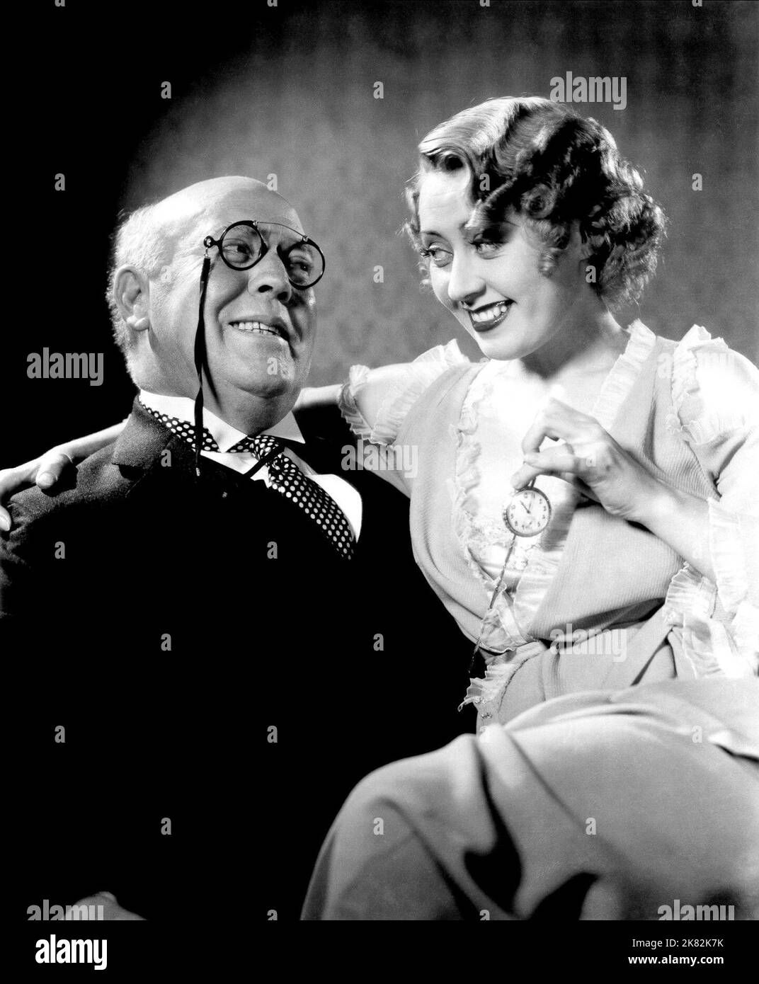 Guy Kibbee & Joan Blondell Film: Gold Diggers Of 1933 (1933) Characters: Fanuel H. Peabody, Carol King  27 May 1933   **WARNING** This Photograph is for editorial use only and is the copyright of WARNER BROS and/or the Photographer assigned by the Film or Production Company and can only be reproduced by publications in conjunction with the promotion of the above Film. A Mandatory Credit To WARNER BROS is required. The Photographer should also be credited when known. No commercial use can be granted without written authority from the Film Company. Stock Photo