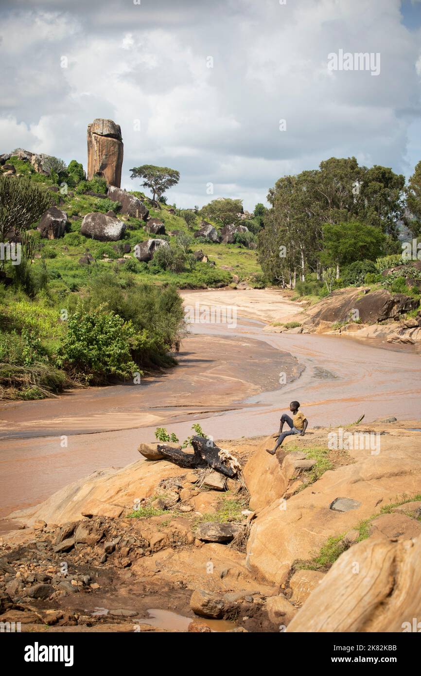 A seasonal river flows through Uganda's Karamoja region, a remote and rocky wilderness in Uganda, East Africa. Stock Photo