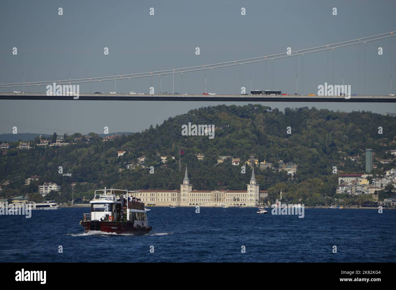 Kuleli Military High School, Bosphorus, Bridge, Boat and blue sea. Istanbul Turkey. Stock Photo