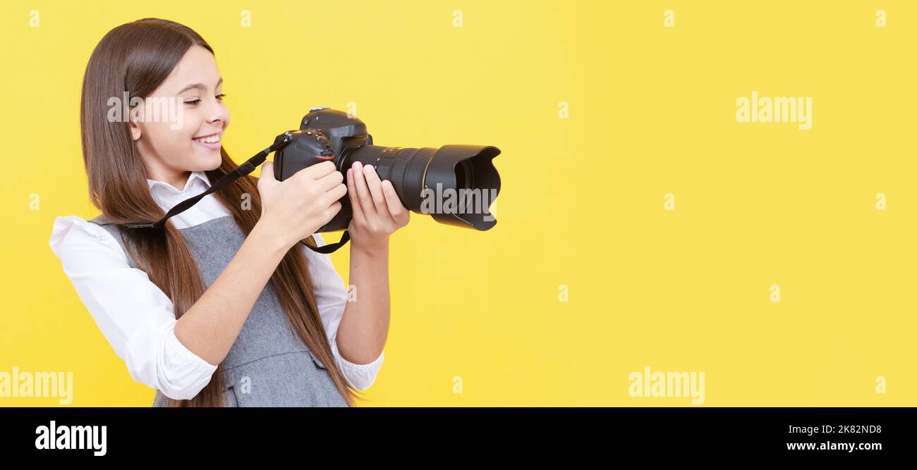 kid use digital camera. happy child photographing. school of photography. hobby or future career. Child photographer with camera, horizontal poster Stock Photo