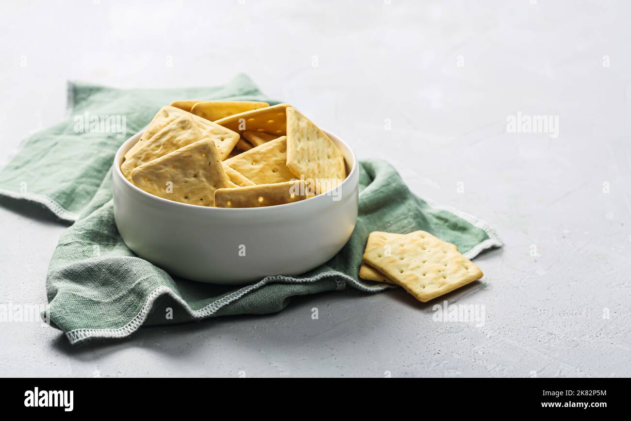 Bowl of dry crackers isolated on gray background with napkin Stock Photo Alamy