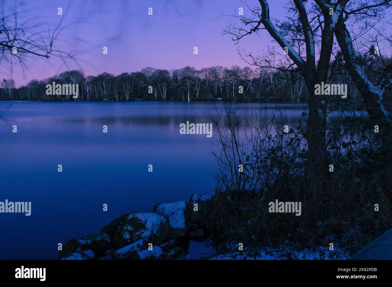 Lake at night in winter at sunrise Stock Photo - Alamy