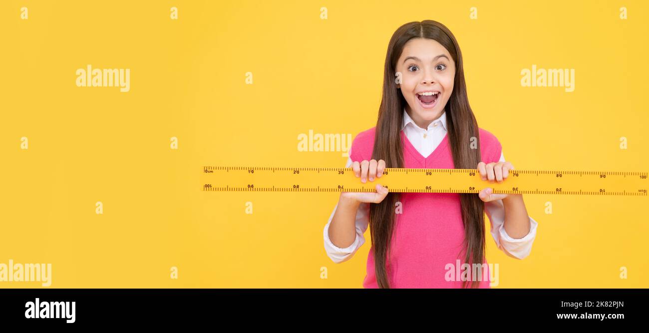 Pupil Using Ruler surprised kid girl use ruler to learn mathematics, measurement. Banner ...