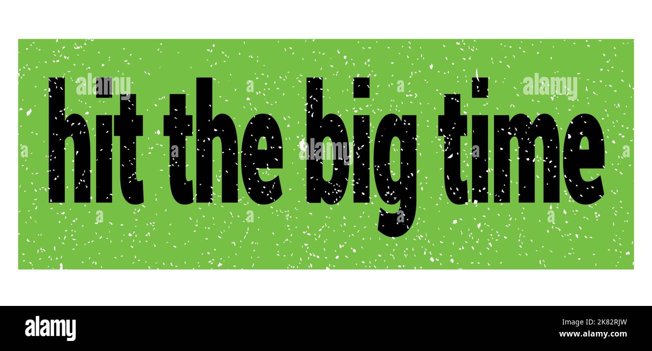 hit the big time text written on greenblack grungy stamp sign Stock