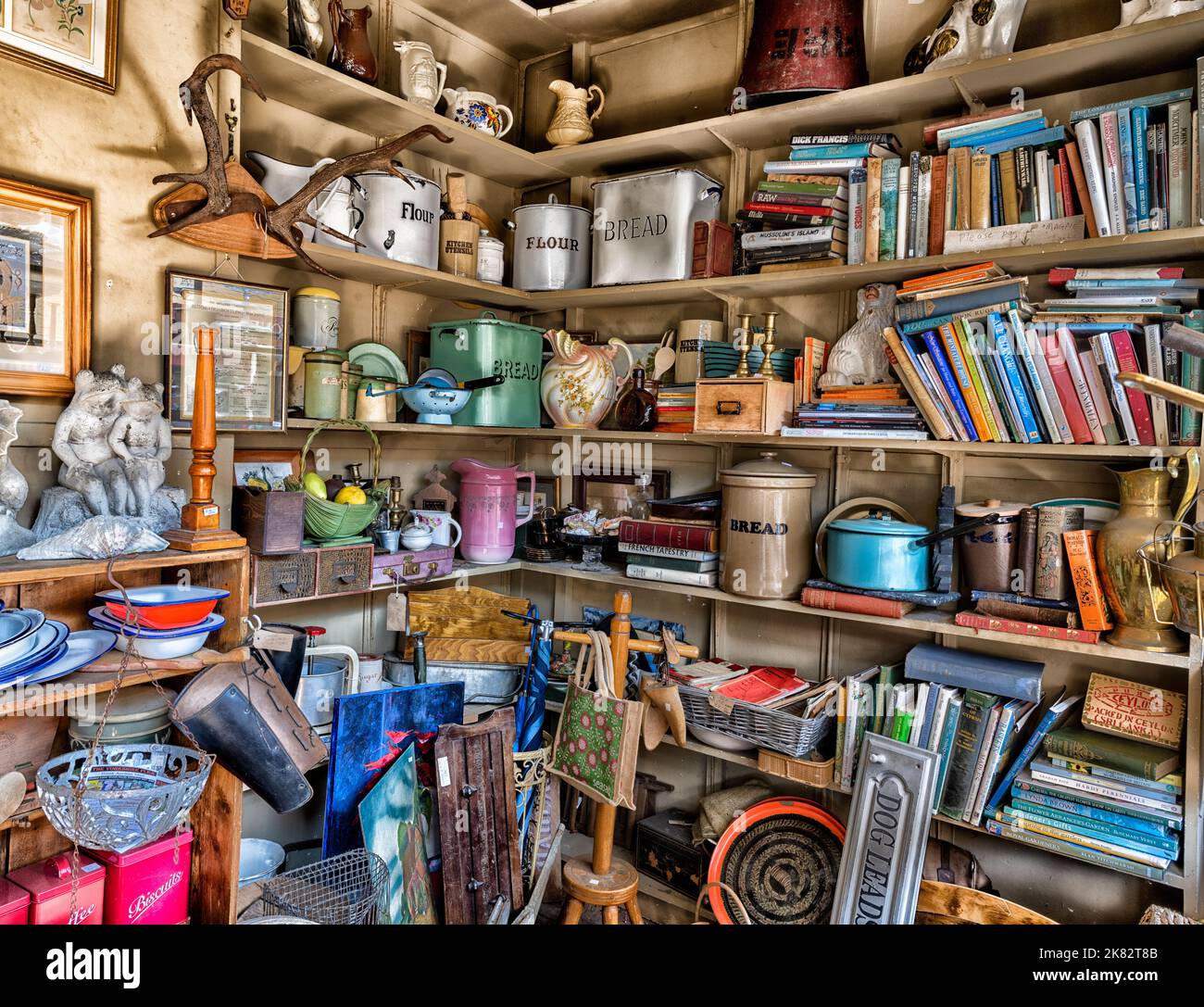 Antiques, collectables and bric-a-brac items on display for sale in an antique shop. Stock Photo