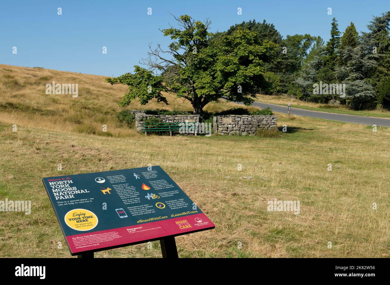 North York Moors National Park information sign wooden seat near a penfold enclosure for stray animals Goathland near Whitby North Yorkshire England Stock Photo
