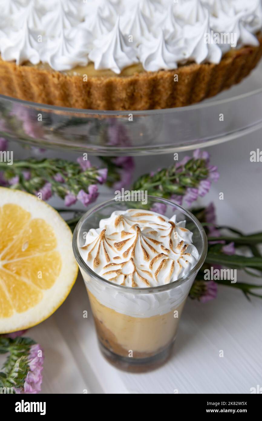 decoration of exquisite chocolate cake with pastry cream next to a cup