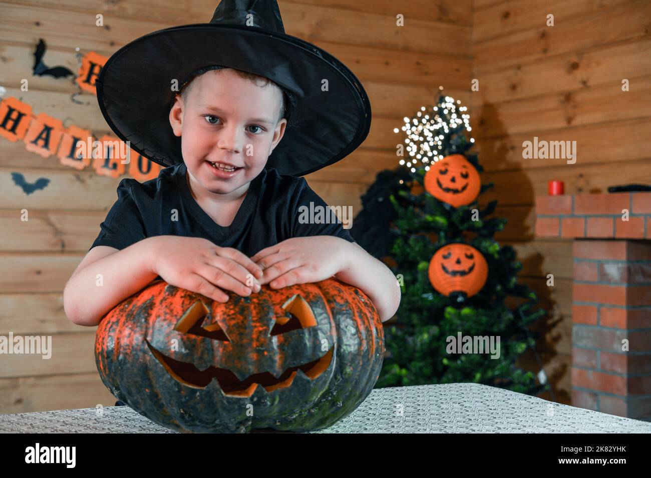 Halloween kids. A cute little boy, with a Jack O Lanter pumpkin, in a